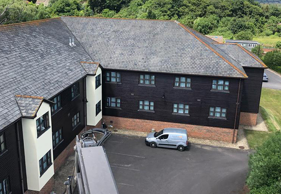 a block of flats painted with black and white paint 